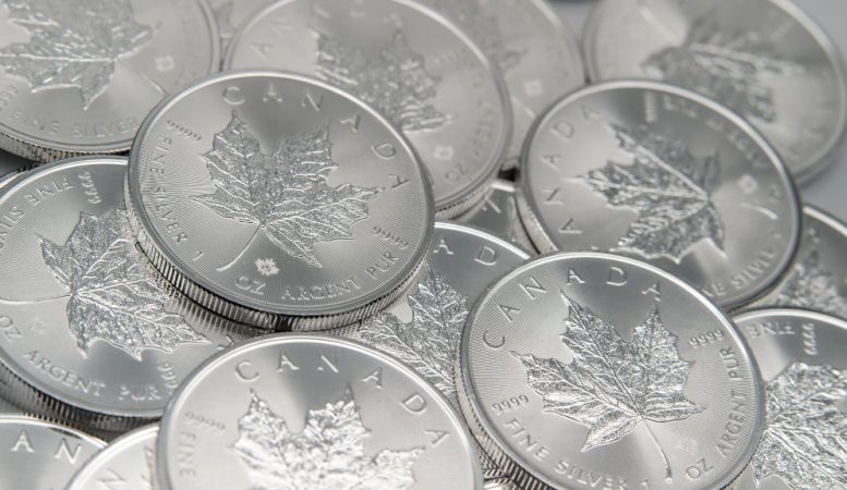 pile of canadian silver maple leaf coin