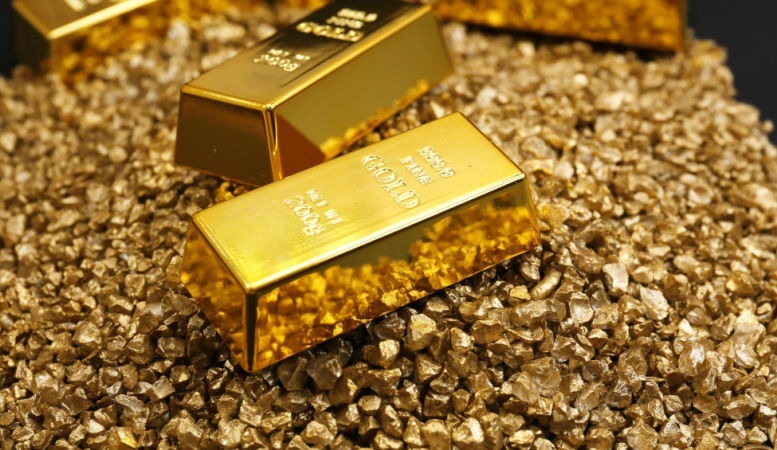gold bars on gold nugget grains background