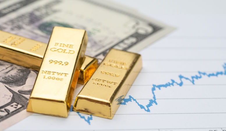 gold bars stack on us dollar banknote and rising price graph