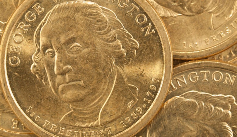 pile of us gold presidential coins featuring george washington