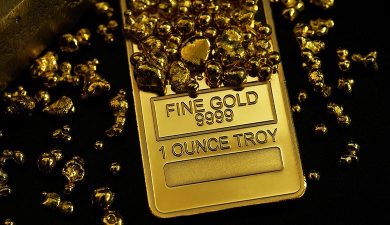 one ounce troy gold bar and gold nuggets