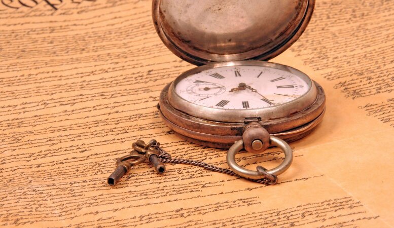 book of history and antique pocket watch