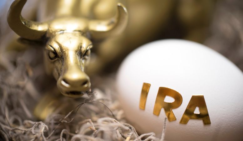 gold bull figure with an egg with written ira