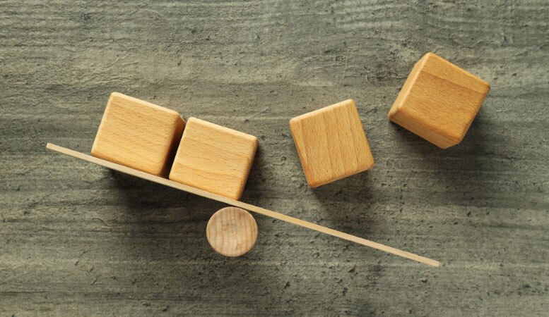 four wooden cubes and wooden scale