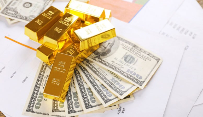 gold bars with dollar banknotes on paper background