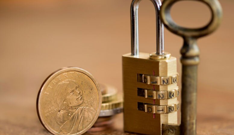 gold coins with lock and key