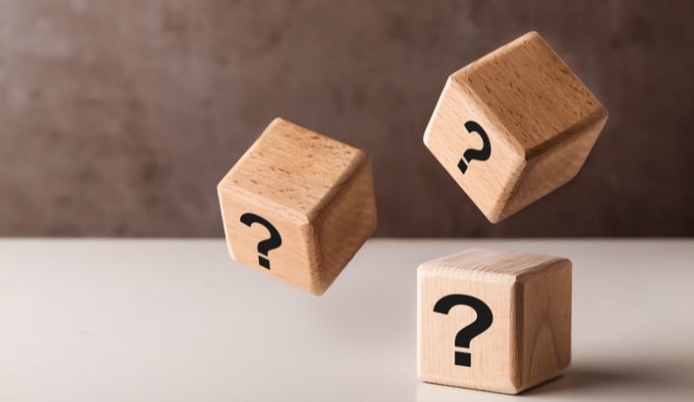 levitating wooden cubes with question marks
