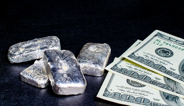 silver bars and hundreds of dollars