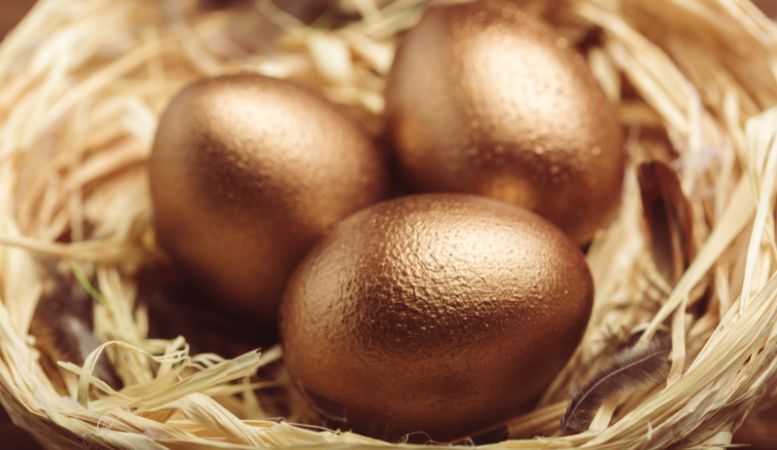 three golden eggs on nest
