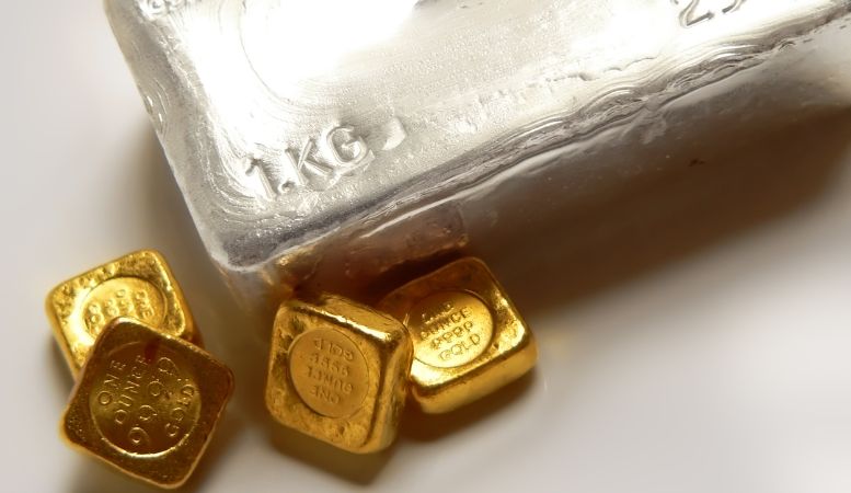 four pieces of one ounce gold bullion and one kilogram silver bar