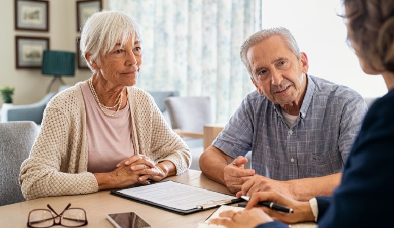 senior couple consulting with financial advisor