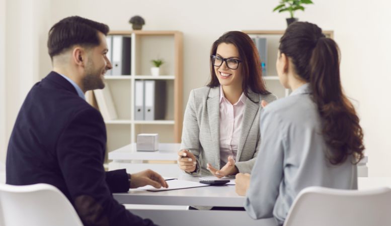 woman financial advisor giving consultation to couple investor