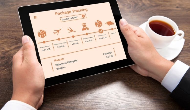 businessman tracking his gold package using tablet