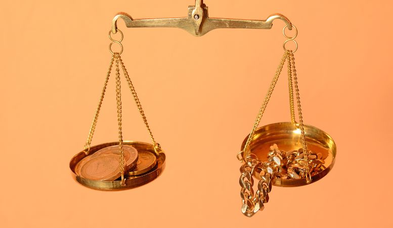 balance scale with us dollar coin and gold filled jewelry