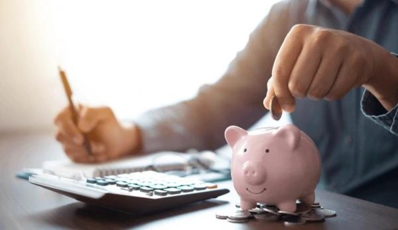 a man saving money with a piggy bank