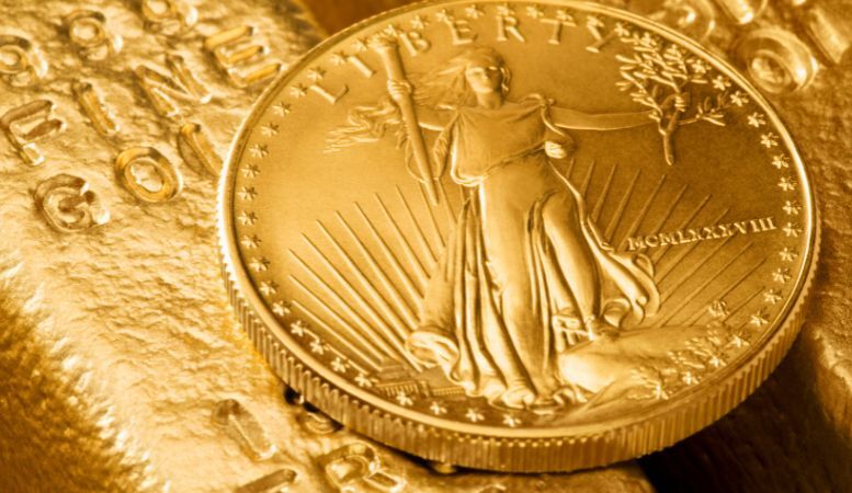 american gold eagle coin on gold bars