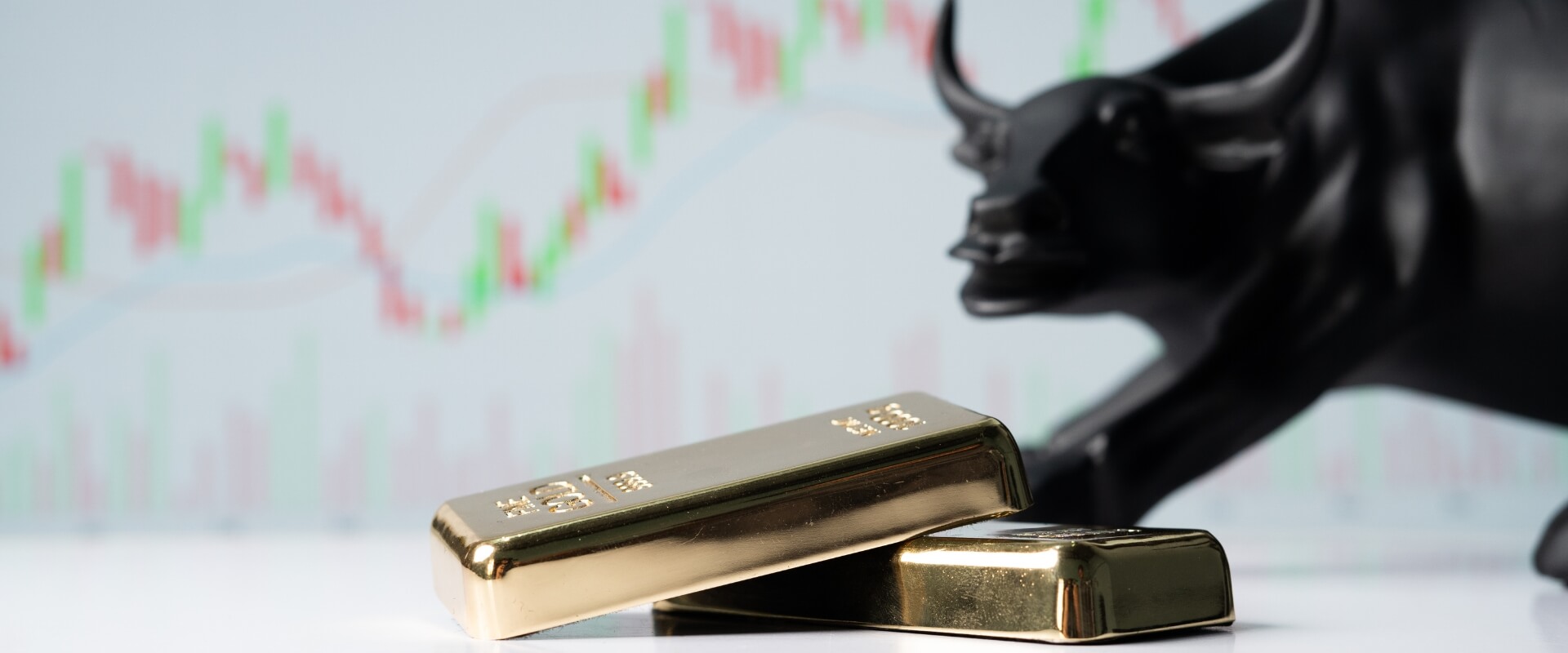 gold bars with a bull in a background
